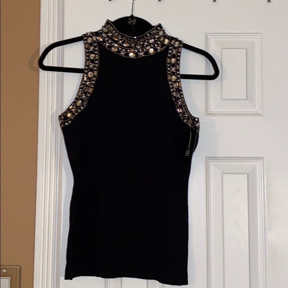 NEW INC Top